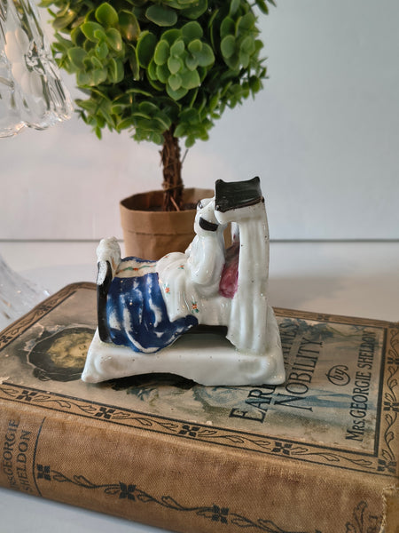 Antique German Fairing Figurine ‘Shall we sleep first, or how?’